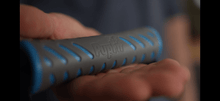 Dog owner holds PupFits ergonomic handle for tug play and leash walks