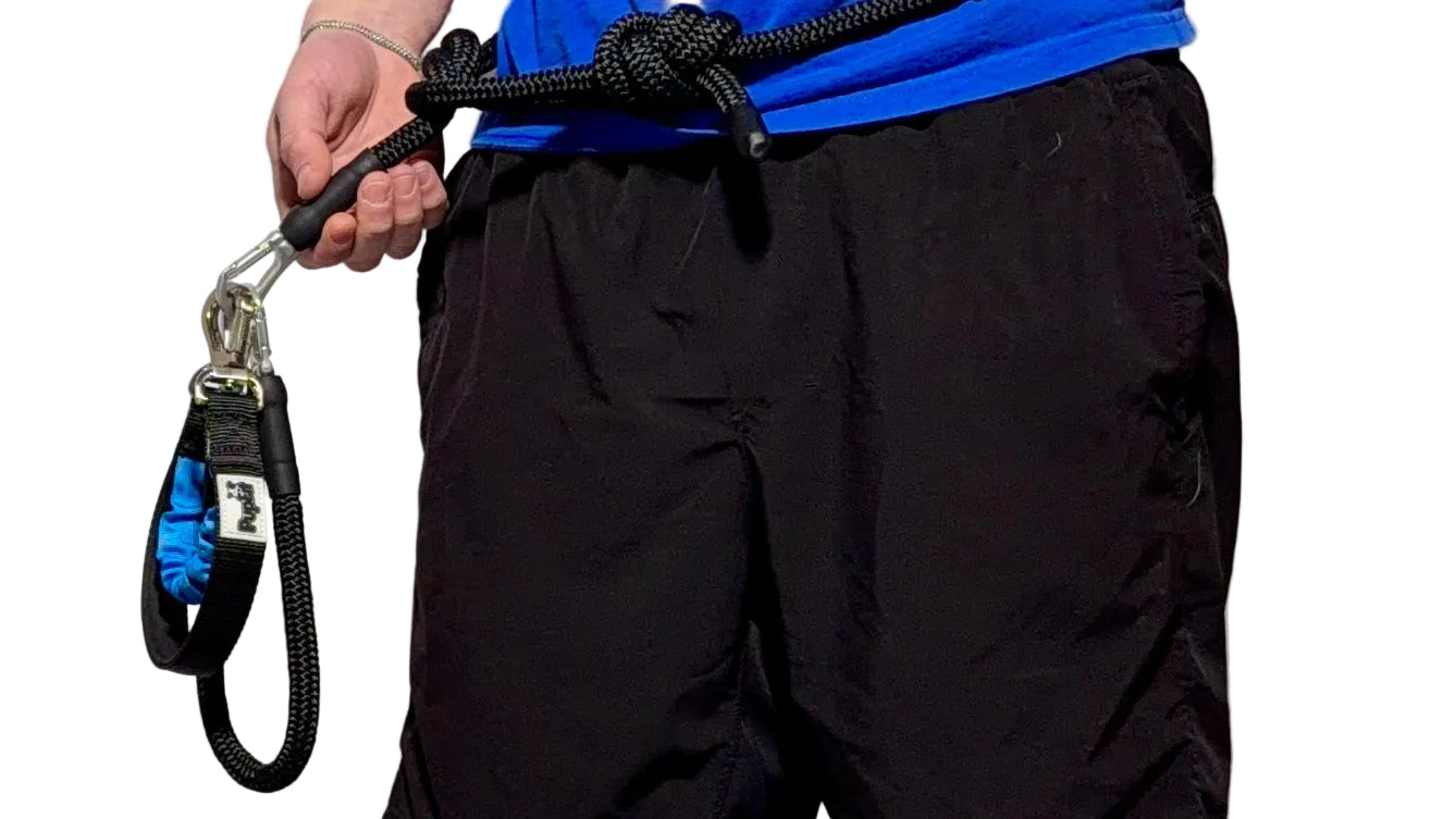 Dog owner using PupFit hands-free leash off-leash outdoors — PupFit fitness system Chicago
